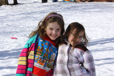 Rosy cheeks. Ashlin, Eleanor, and lone pink glove in February 2011.