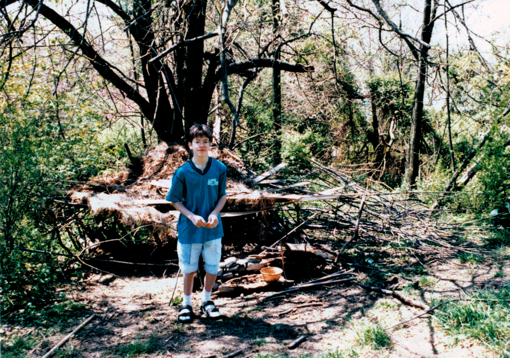 Lucas with a fort he almost certainly didn't build alone. (There's a post-it note on the back of this one that says "M's", which makes me think it wasn't originally part of the school's collection. Is it yours?)